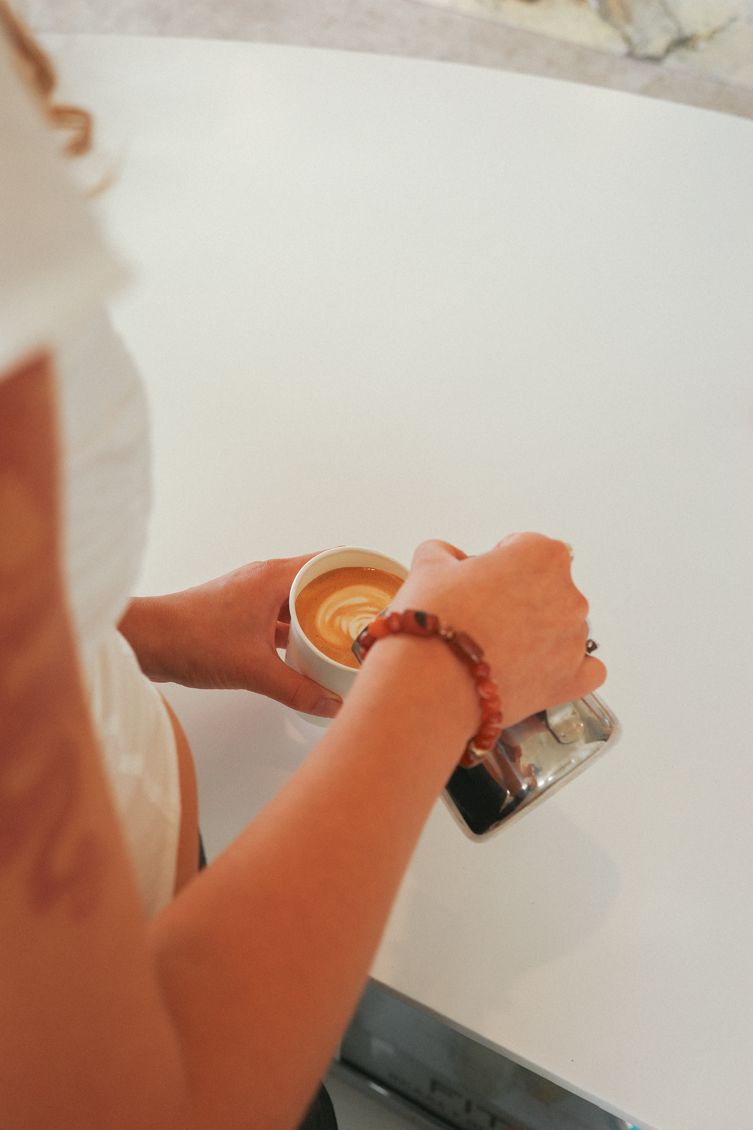 A flat white with latte art, viewed from above.