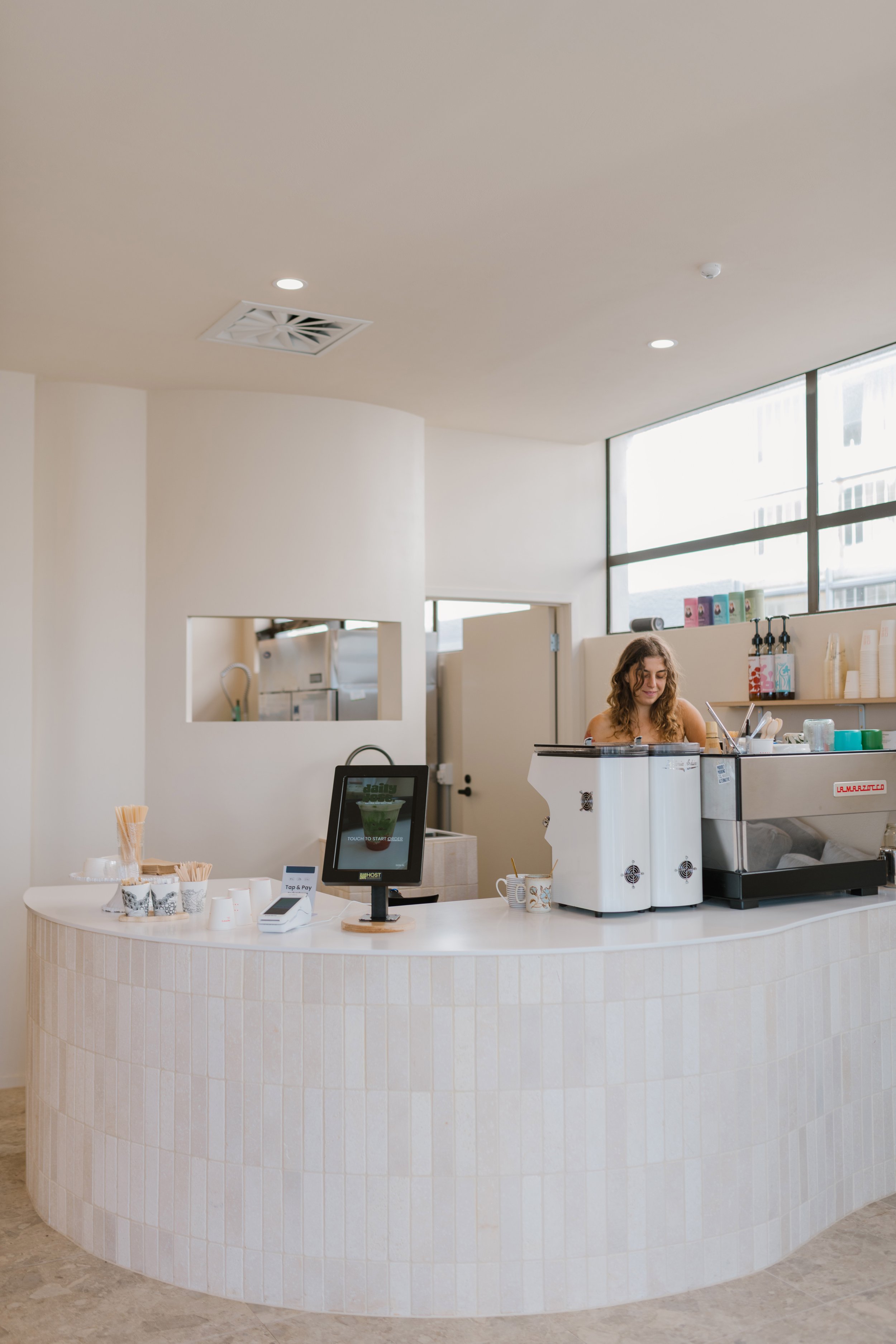 The cream-tiled counter inside Daily Dose.